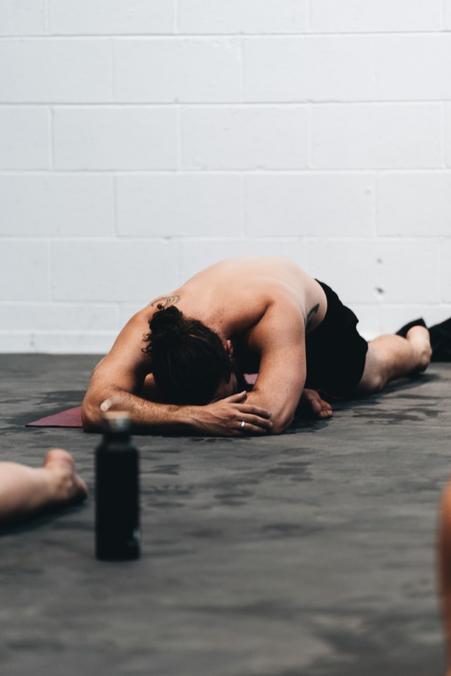 man stretching in gym