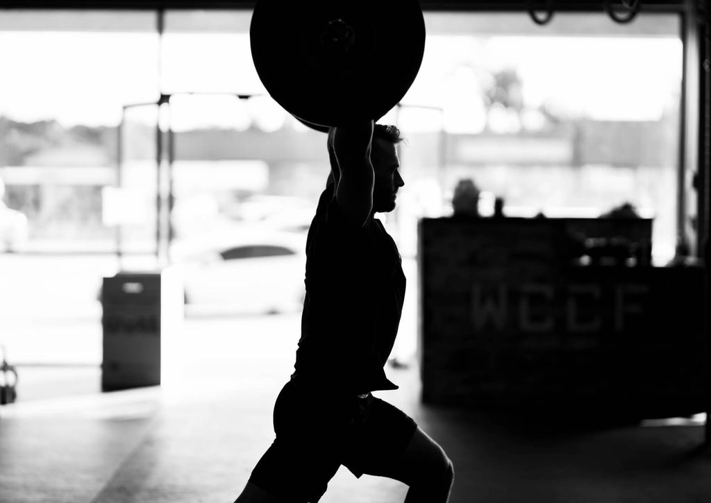 man training CrossFit in gym