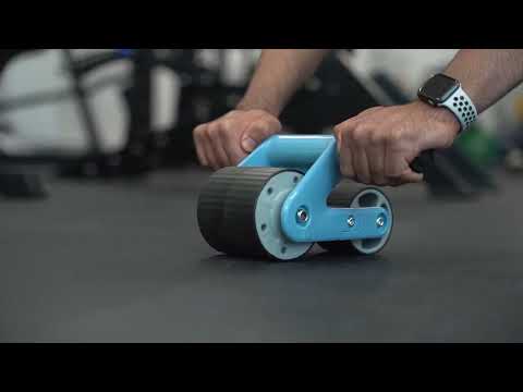 man using blue ab wheel roller in gym